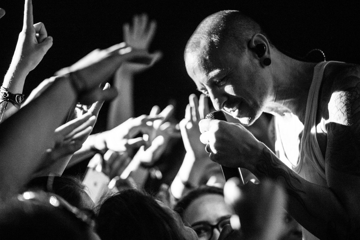 black and white close up of chester interating with fans